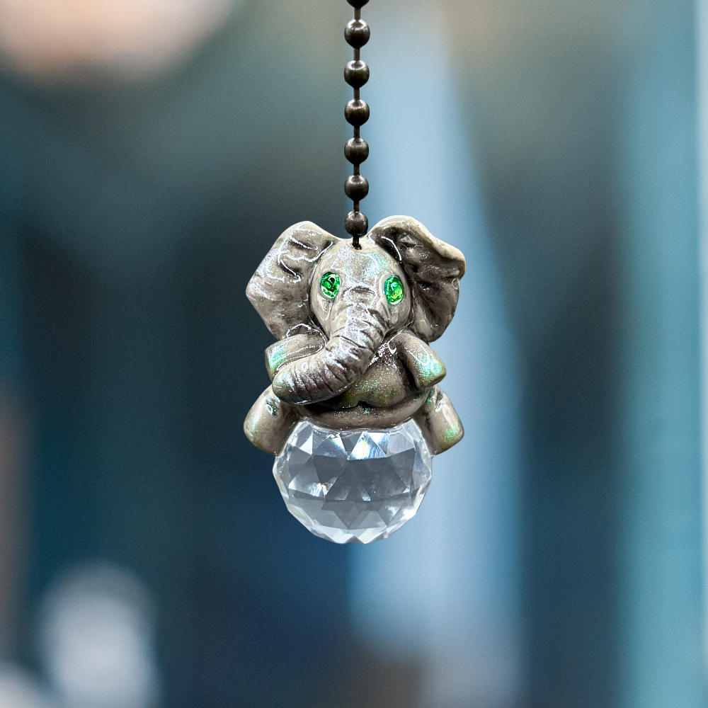 Decorative elephant pendant with a crystal ball