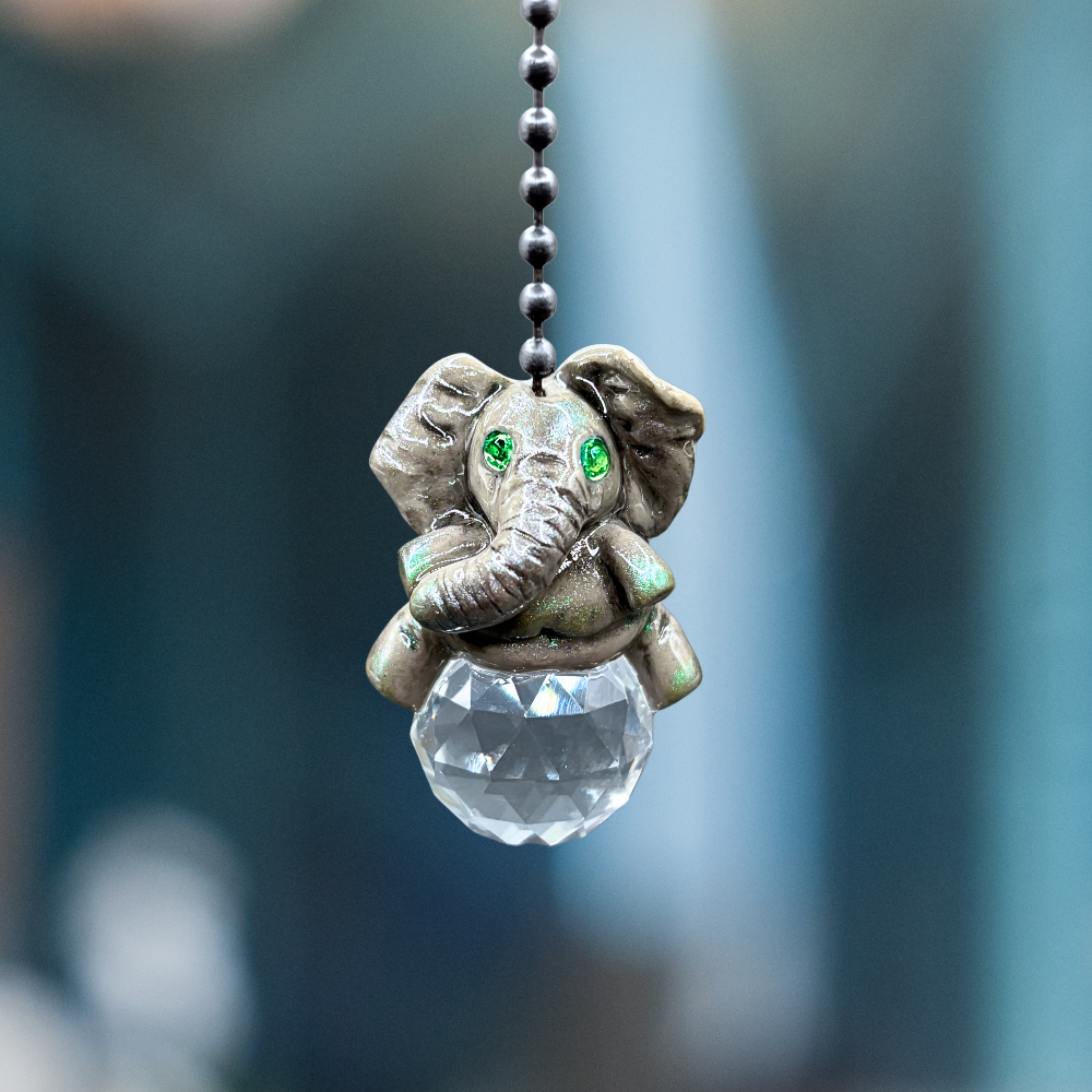 Decorative elephant pendant with a crystal ball