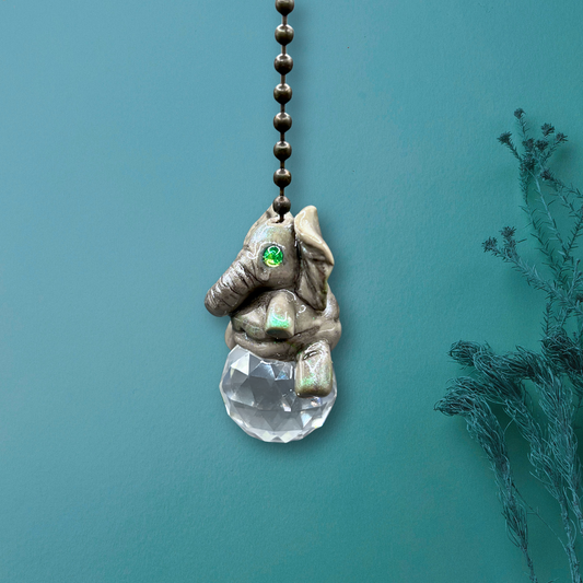 Decorative elephant pendant with a crystal ball