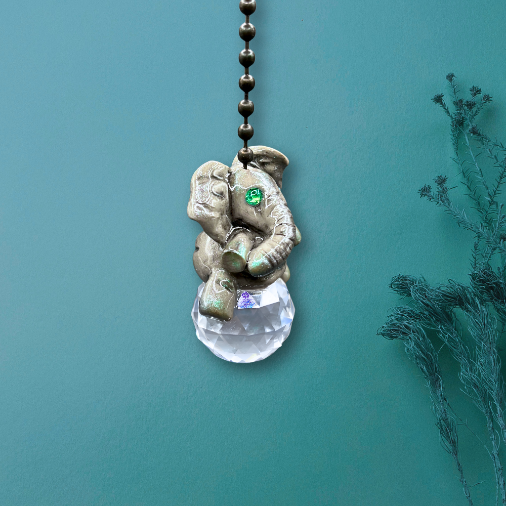 Decorative elephant pendant with a crystal ball