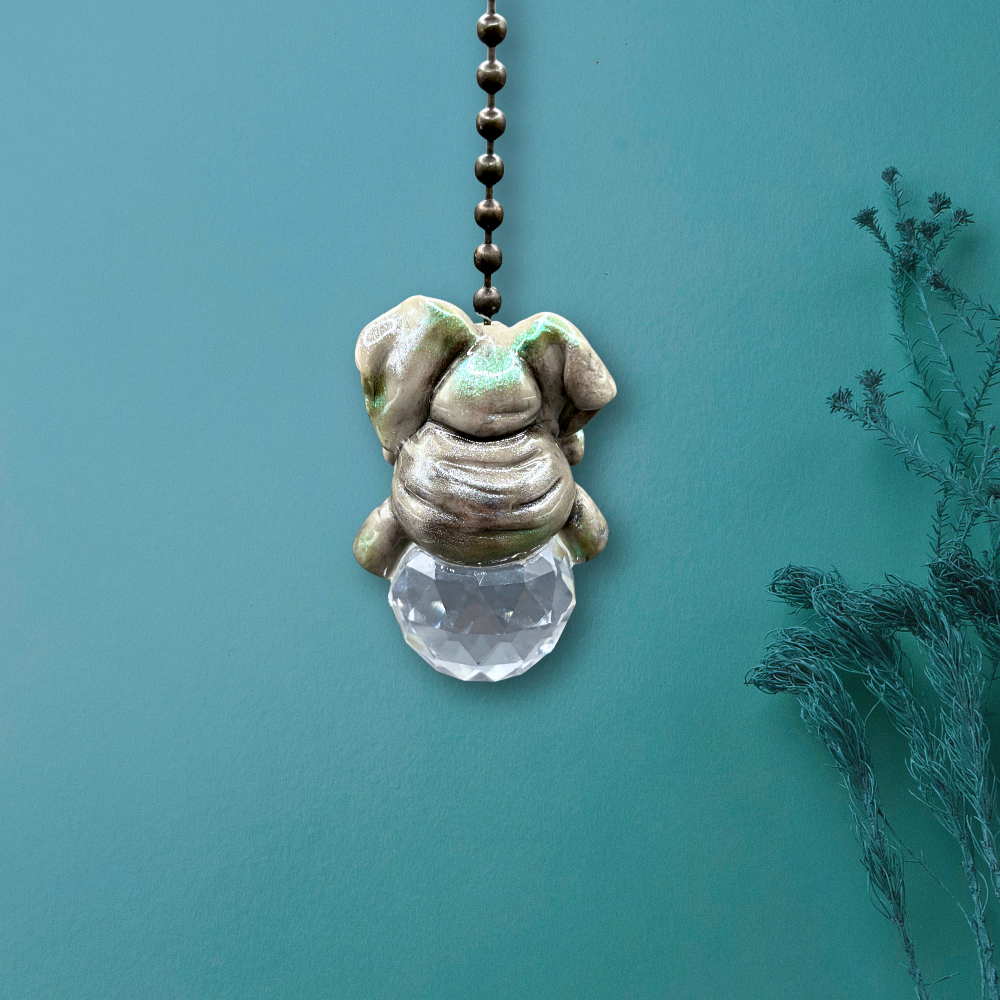 Decorative elephant pendant with a crystal ball