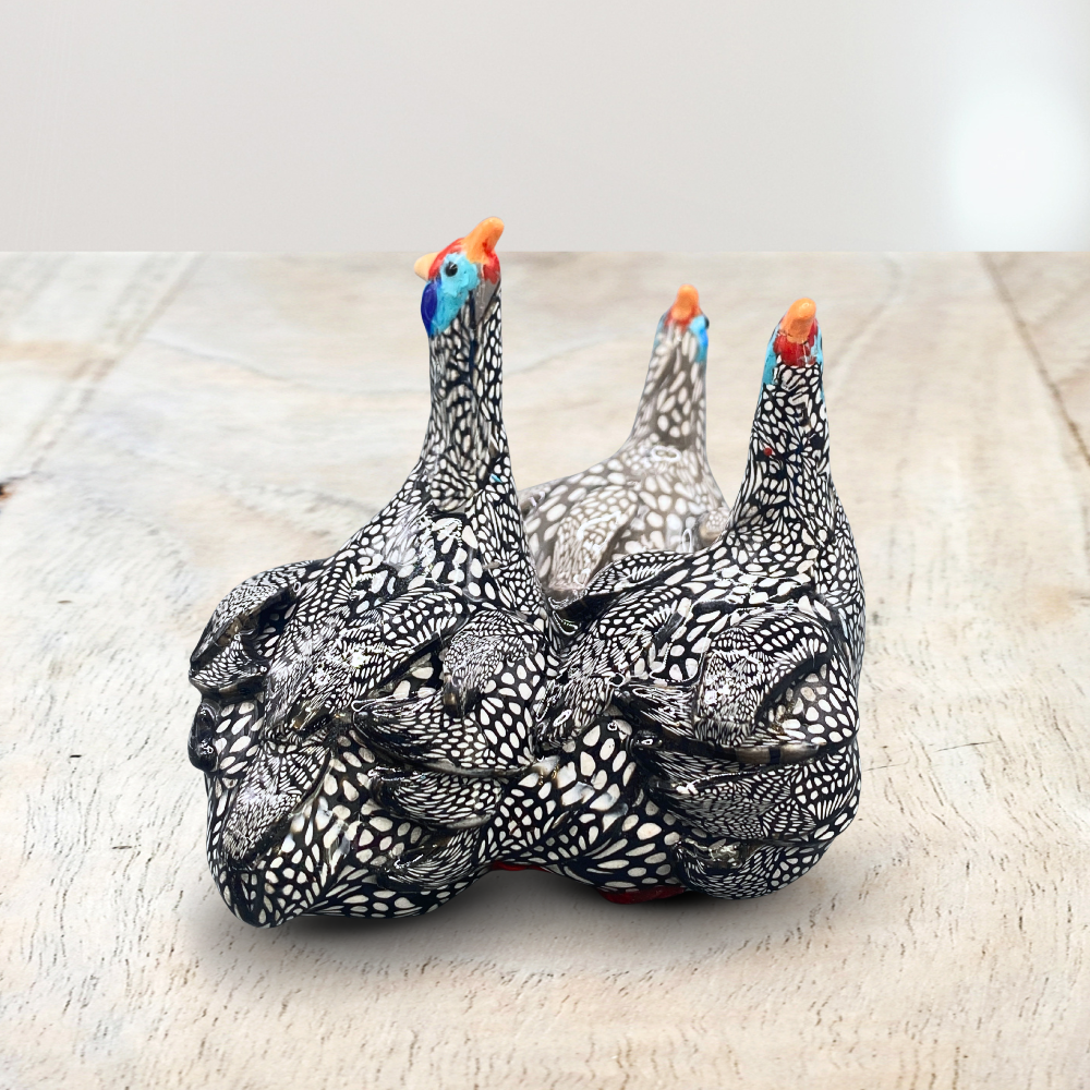A sculpture of 3 Guinea Fowl adults made with Polymer clay
