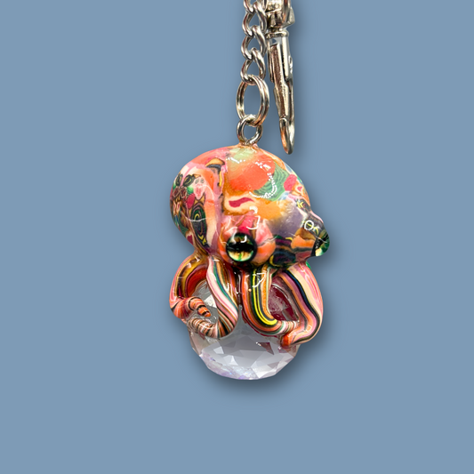This beautiful multicolored Octopus Crystal keychain with Orange over tone, is also available as car charm. Handmade with polymer clay .