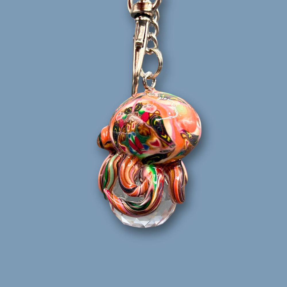 This beautiful multicolored Octopus Crystal keychain with Orange over tone, is also available as car charm. Handmade with polymer clay .