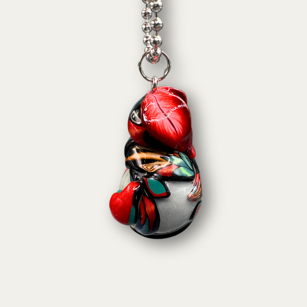 This Red bug car charm for your rear view mirror is handmade with Polymer clay. Its a unique car cham with a real marble in its belly.