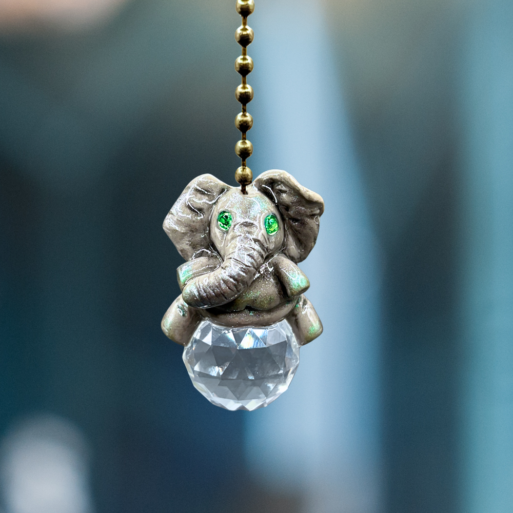 Decorative elephant pendant with a crystal ball 