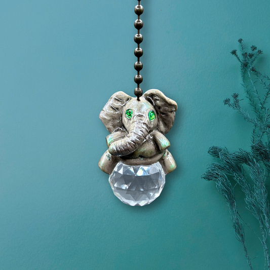 Decorative elephant pendant with a crystal ball 