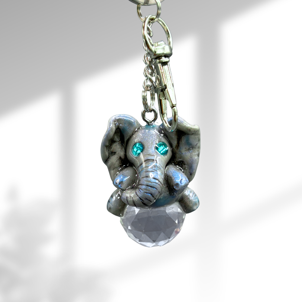 Keychain with elephant charm and clear crystal on a light background