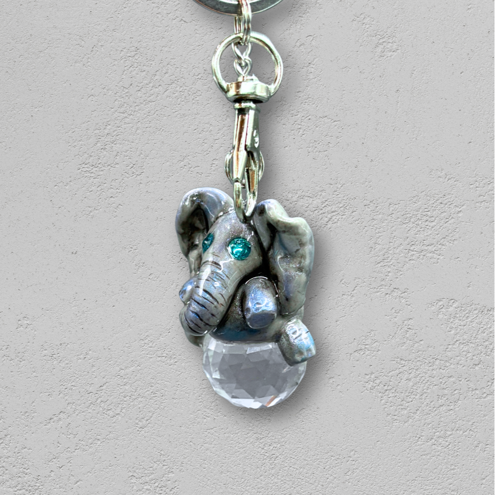 Keychain with elephant charm and clear crystal on a light background