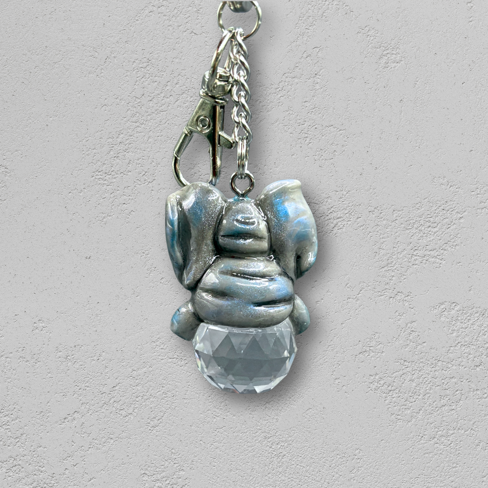 Keychain with elephant charm and clear crystal on a light background