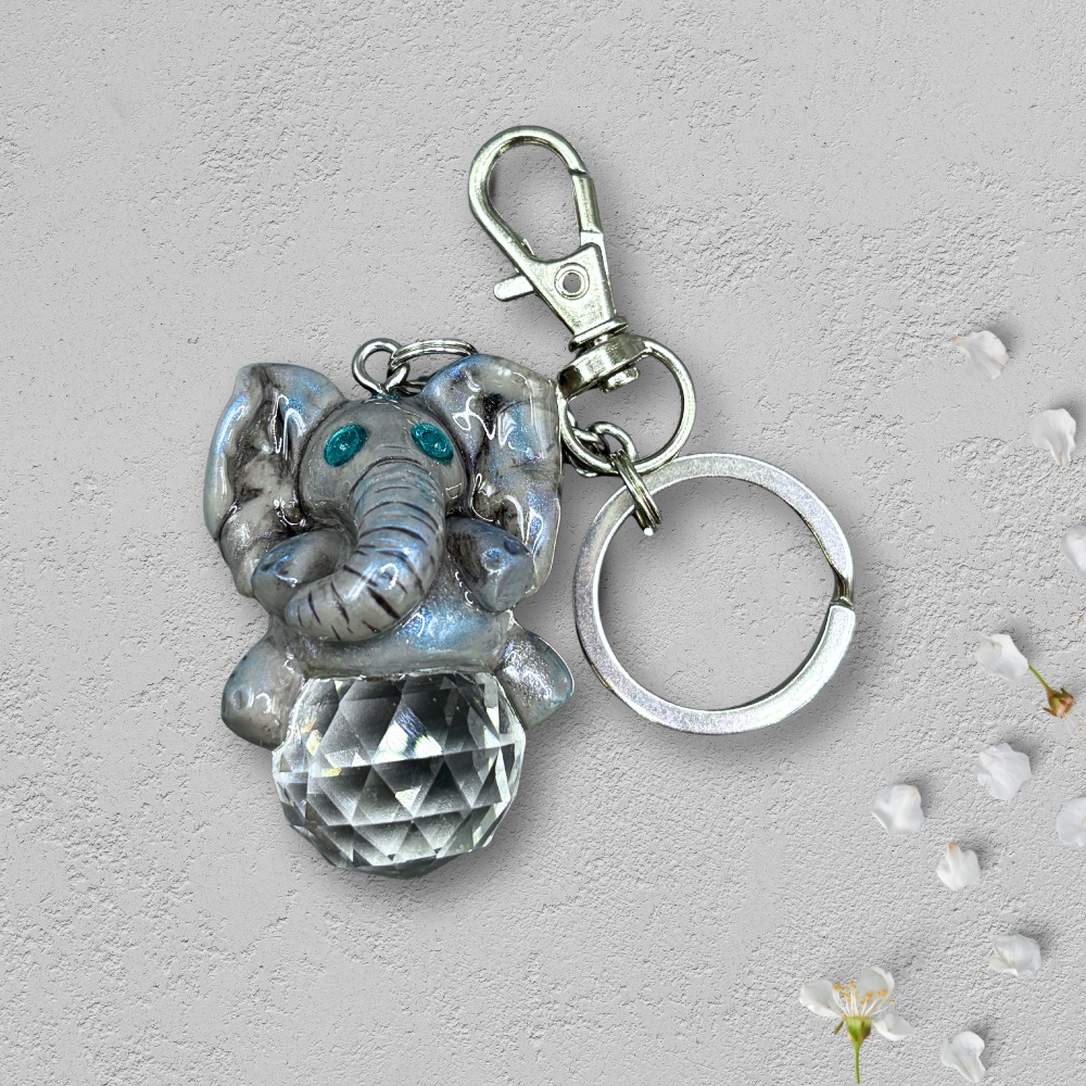 Keychain with elephant charm and clear crystal on a light background