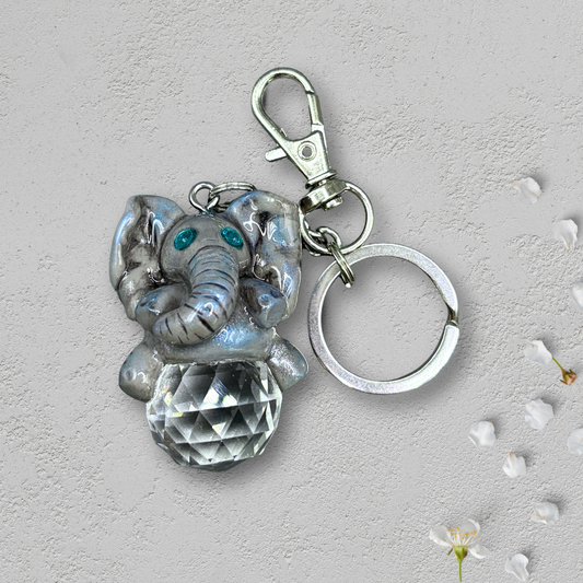 Keychain with elephant charm and clear crystal on a light background
