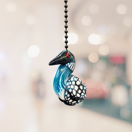 A handmade  Loon charm used as a light or fan pull. 