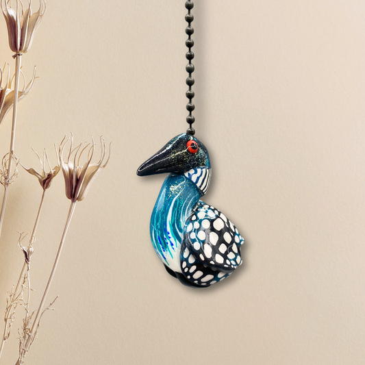 A handmade  Loon charm used as a light or fan pull. 