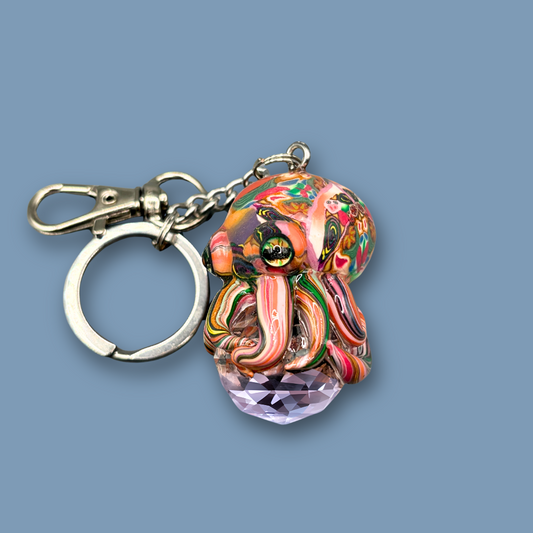 This beautiful  multicolored Octopus Crystal keychain with Orange over tone, is also available as  car charm. Handmade with polymer clay . 